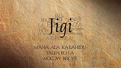Text "Jigi" and words in various languages on a textured brown background.