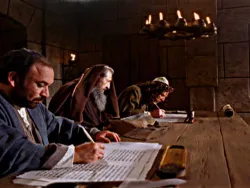 Three men in robes write on scrolls at a wooden table under candlelight.